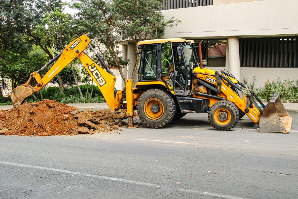 An excavator at an urban work site in Sandton