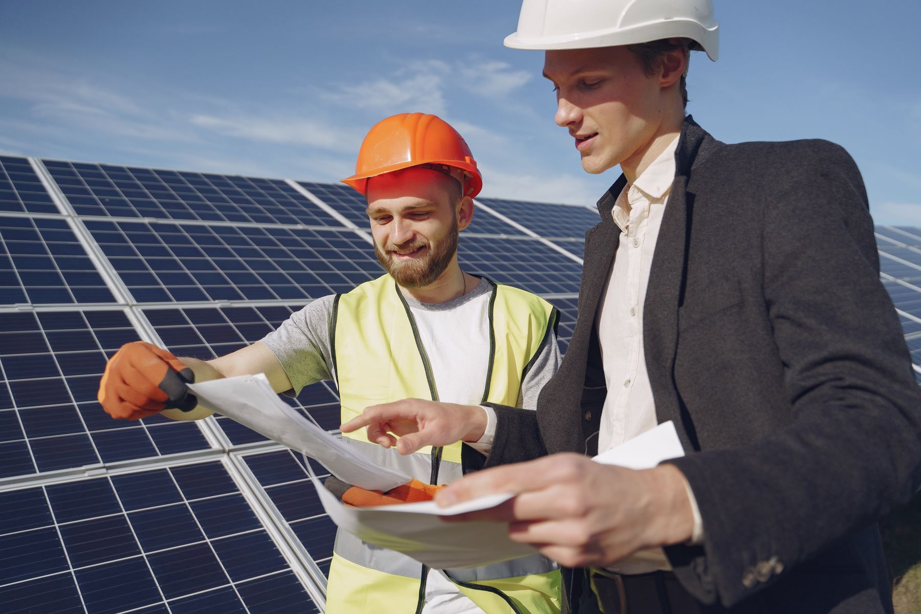 Two professionals planning a solar installation
