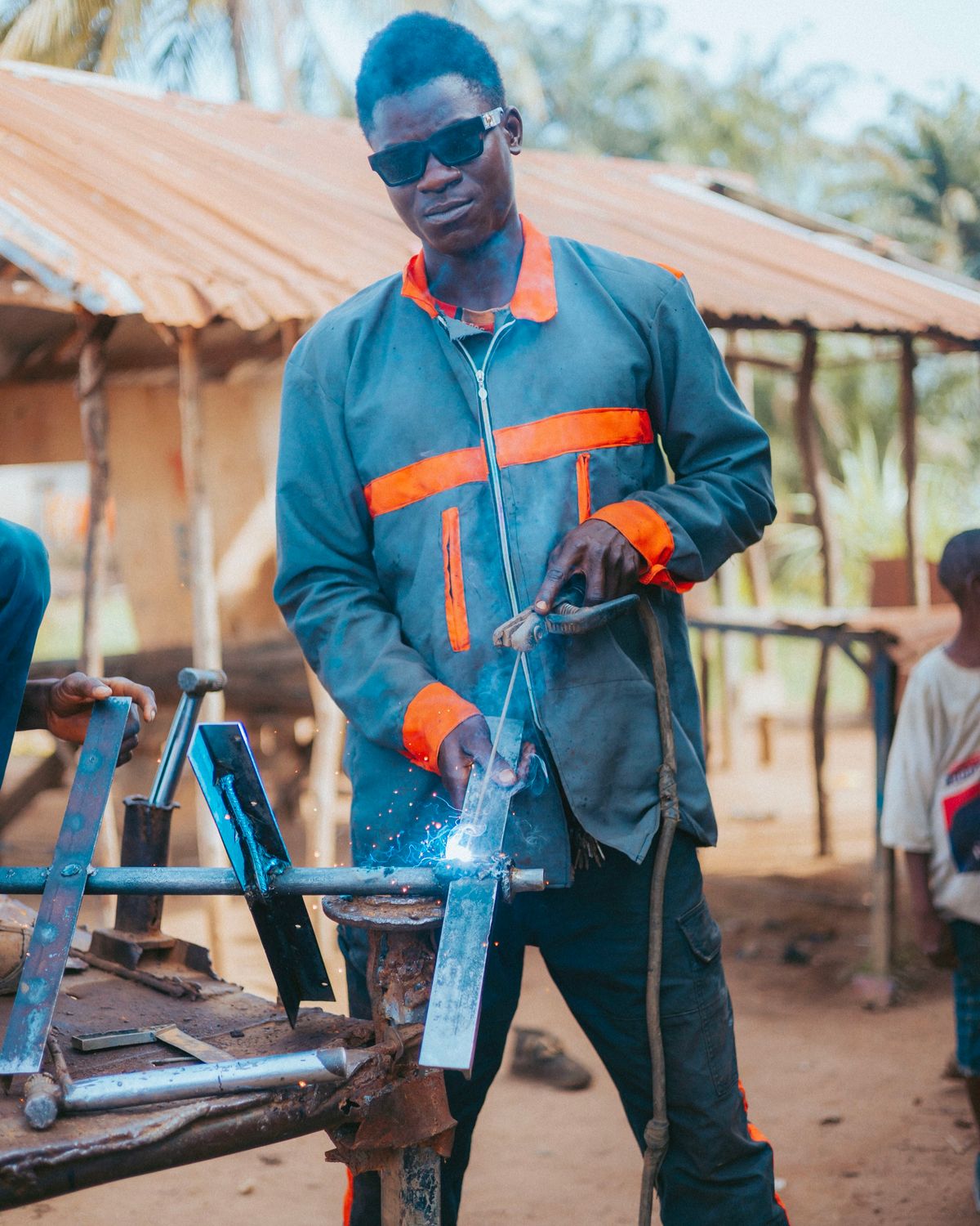 A welder working in protective equipment in Monrovia