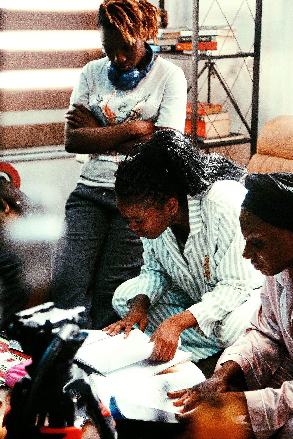 A group reviewing study materials together in Abuja
